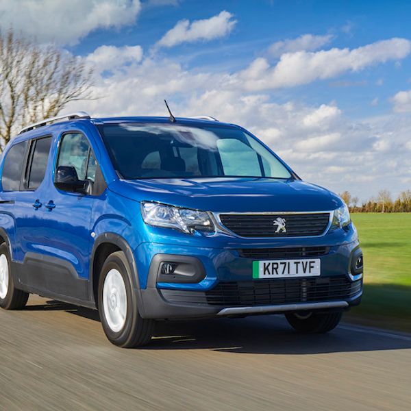 Peugeot e-Rifter, action shot, front three quarters, UK registered, blue car